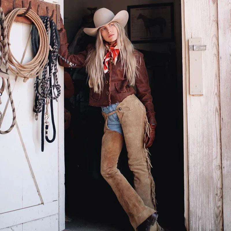 Women’s tan suede fringe chaps fitted western style front view